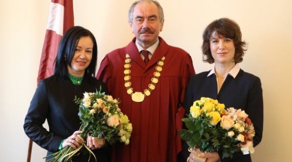 Chief Justice accepts an oath of two notaries 